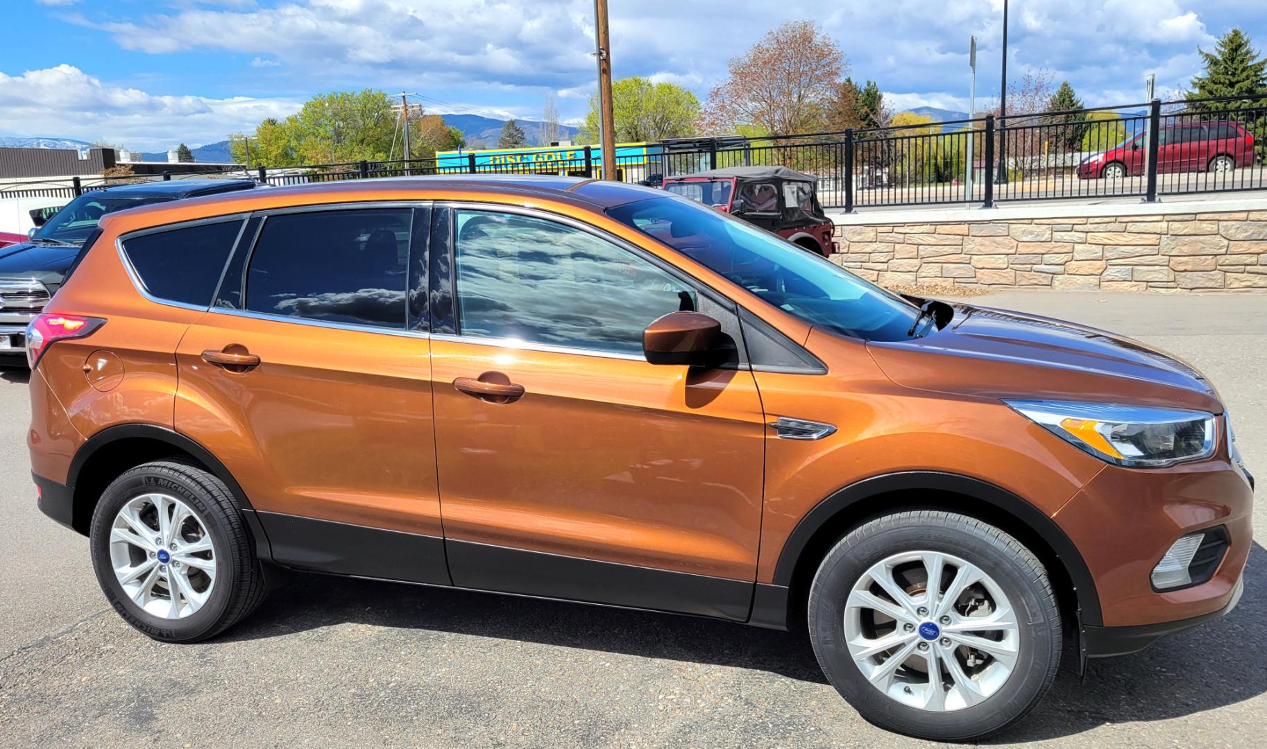 2017 Copper /Black Ford Escape SE (1FMCU9GD1HU) with an 1.5L I4 engine, 6 Speed Auto transmission, located at 450 N Russell, Missoula, MT, 59801, (406) 543-6600, 46.874496, -114.017433 - Nice Low Mile All Wheel Drive. Only 59K Miles. 1.5L I4 Engine. 6 Speed Automatic Transmission. Very Clean. Power drivers Seat. Air. Cruise. Tilt. Power Windows and Locks. Backup Camera. - Photo#5